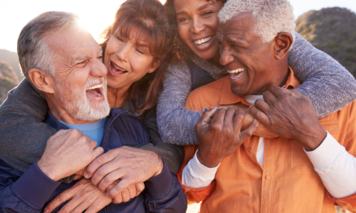Smiling,Senior,Friends,Having,Fun,Walking,In,Countryside,Together